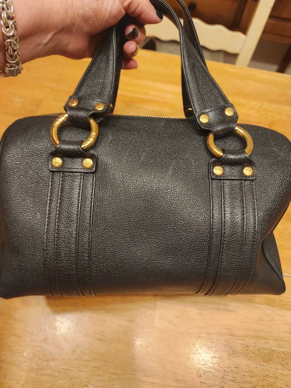 MCM Black Leather Boston Bag featuring polished gold-tone hardware